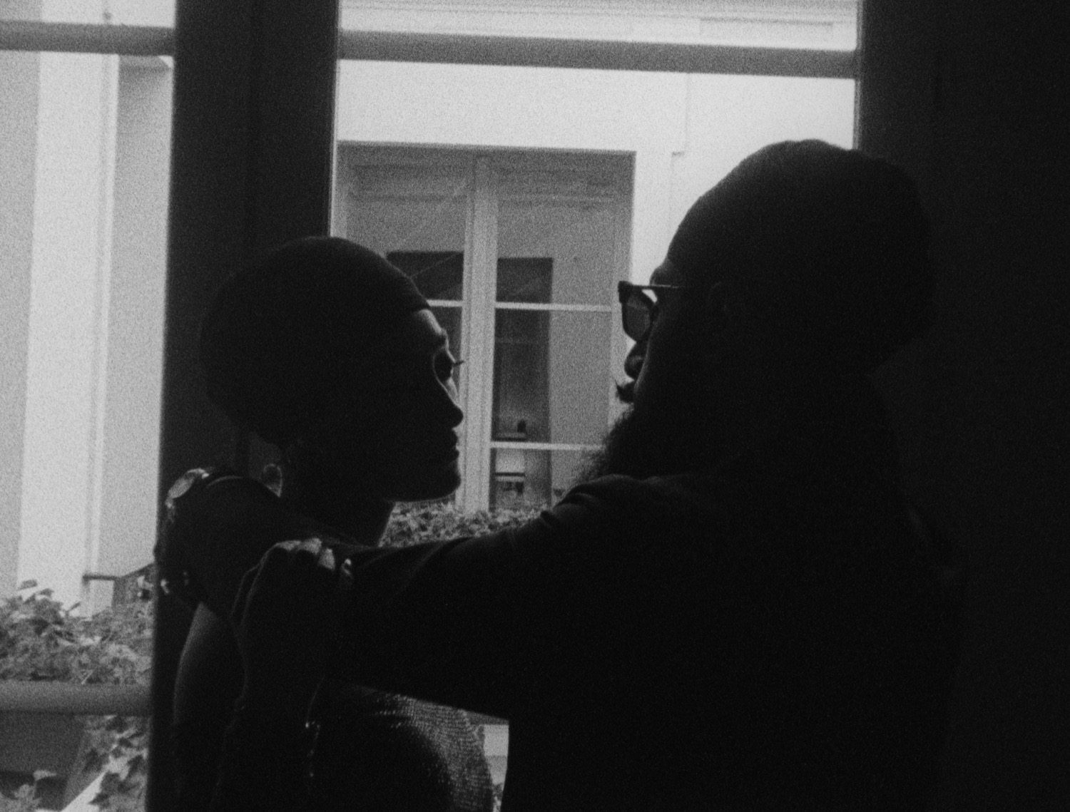 Anoop & Rasans in profile by a Parisian window