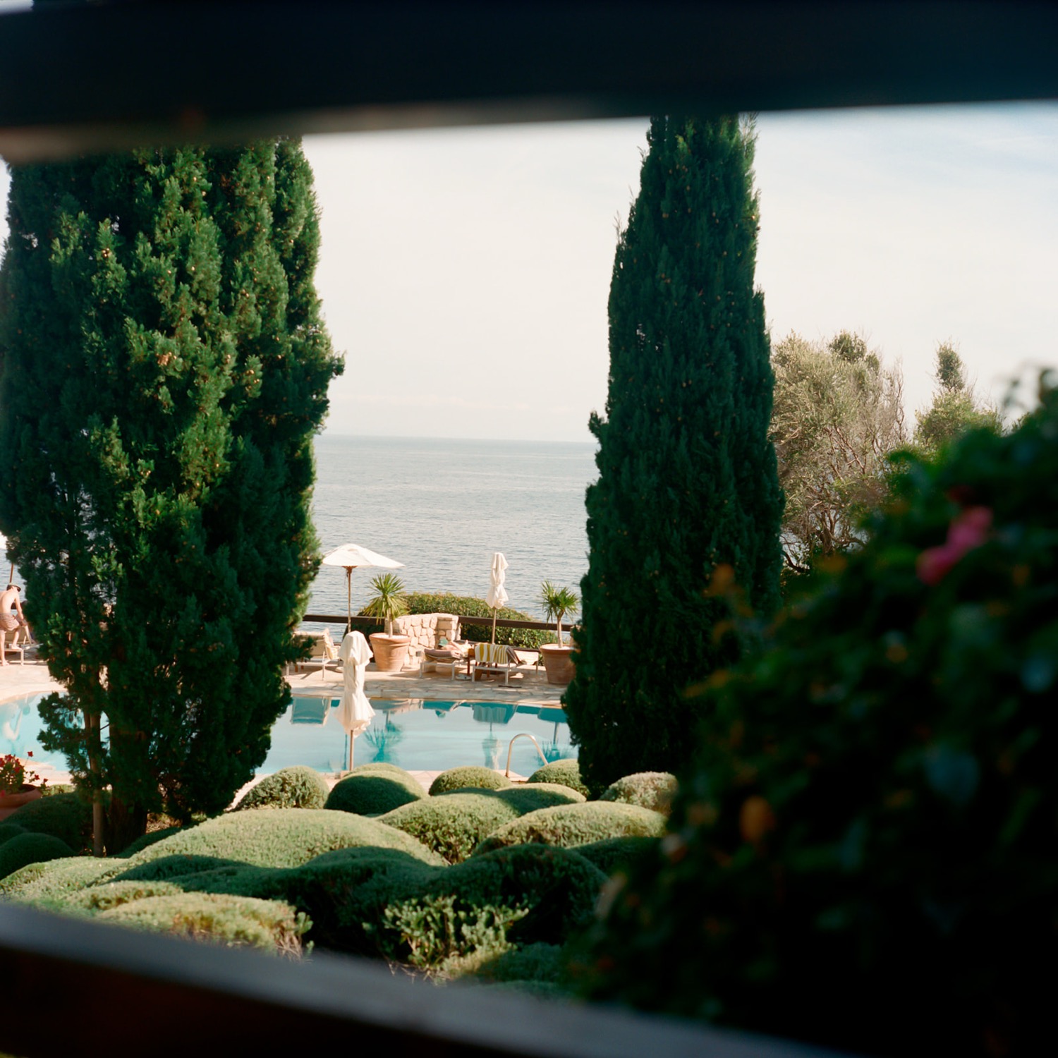 The garden and pool above the sea, before the day began